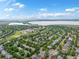 A beautiful aerial view of the neighborhood showcasing the lush green trees and expansive lake at 5660 S Eaton St, Littleton, CO 80123