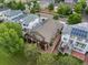 Aerial view of a house featuring a deck and solar panels with surrounding greenery at 5660 S Eaton St, Littleton, CO 80123