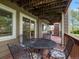 Outdoor covered deck space with seating, perfect for relaxing and entertaining at 5660 S Eaton St, Littleton, CO 80123