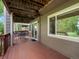 Spacious wooden deck, featuring a table and chairs, with views of the surrounding yard at 5660 S Eaton St, Littleton, CO 80123