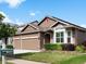 Charming home showcasing well-kept landscaping, a three-car garage, and traditional design elements at 5660 S Eaton St, Littleton, CO 80123