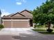Inviting home with a three-car garage, well-maintained lawn, and traditional architectural details at 5660 S Eaton St, Littleton, CO 80123