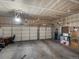 Spacious three-car garage with ample storage space and two large garage doors at 5660 S Eaton St, Littleton, CO 80123