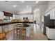 Kitchen boasts white cabinets, a tile backsplash, and stainless steel appliances at 5660 S Eaton St, Littleton, CO 80123