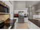 This kitchen has stainless appliances, ample cabinet space, and a modern refrigerator at 5660 S Eaton St, Littleton, CO 80123