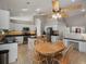 Spacious kitchen with a dining table, stainless steel appliances, and ample counter space at 5660 S Eaton St, Littleton, CO 80123