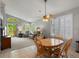 Cozy living room features large windows and a comfortable seating arrangement at 5660 S Eaton St, Littleton, CO 80123