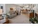 Comfortable living room with plenty of natural light flows to the kitchen and dining area at 5660 S Eaton St, Littleton, CO 80123