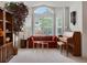 Bright living room featuring large windows, a comfortable sofa, and stylish decor at 5660 S Eaton St, Littleton, CO 80123