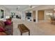 Spacious living room features neutral carpet, large TV, and comfortable furniture at 5660 S Eaton St, Littleton, CO 80123