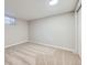 Carpeted basement space with a small window at 3750 S Fairplay Way, Aurora, CO 80014