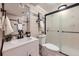 Updated bathroom featuring a modern vanity, decorative tile, and sleek glass-enclosed shower at 3750 S Fairplay Way, Aurora, CO 80014