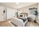 Serene bedroom with a comfortable bed, neutral tones, and natural light creates a relaxing retreat at 3750 S Fairplay Way, Aurora, CO 80014