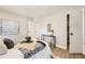 Bright bedroom with stylish decor, natural light and wood floors at 3750 S Fairplay Way, Aurora, CO 80014