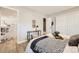 Cozy bedroom featuring wood-look floors, closet, and decorative accents at 3750 S Fairplay Way, Aurora, CO 80014