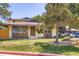 Charming single-story home with well-maintained lawn and mature trees at 3750 S Fairplay Way, Aurora, CO 80014