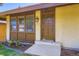 Inviting home exterior showcasing the front door, detailed trim, and landscaped garden bed at 3750 S Fairplay Way, Aurora, CO 80014