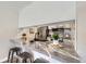 Stylish kitchen bar with seating, showcasing stainless steel appliances and modern countertops at 3750 S Fairplay Way, Aurora, CO 80014