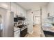 Well-equipped kitchen with stainless steel appliances, modern backsplash, and efficient layout at 3750 S Fairplay Way, Aurora, CO 80014