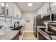 Modern kitchen featuring stainless steel appliances, sleek countertops, and ample cabinet space at 3750 S Fairplay Way, Aurora, CO 80014