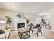 Inviting living room features a brick fireplace, neutral decor, and an open layout with modern flooring at 3750 S Fairplay Way, Aurora, CO 80014