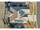 Aerial view of home's roof with solar panels, a well-maintained yard, and a driveway leading to the property at 27655 E Moraine Dr, Aurora, CO 80016