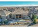 Expansive backyard with a deck, patio, hot tub, fire pit, and a well-manicured lawn for outdoor enjoyment at 27655 E Moraine Dr, Aurora, CO 80016