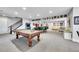 Finished basement features a billiard table and entertainment area at 27655 E Moraine Dr, Aurora, CO 80016