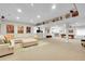 Large finished basement featuring neutral carpet, a wet bar, a pool table, and movie-themed decor at 27655 E Moraine Dr, Aurora, CO 80016