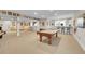 Basement with carpet, a pool table, a wet bar with bar stools, and plenty of space at 27655 E Moraine Dr, Aurora, CO 80016
