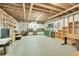 Unfinished basement features exposed beams, a work bench, and tool storage at 27655 E Moraine Dr, Aurora, CO 80016