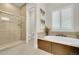 Elegant bathroom with walk-in shower, soaking tub, and modern fixtures at 27655 E Moraine Dr, Aurora, CO 80016