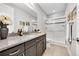 Bathroom featuring a granite countertop, tiled floor, and glass-enclosed shower at 27655 E Moraine Dr, Aurora, CO 80016