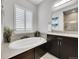Relaxing bathroom with a soaking tub, elegant fixtures, and natural light at 27655 E Moraine Dr, Aurora, CO 80016