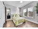 Bright bedroom with hardwood floors and plantation shutters at 27655 E Moraine Dr, Aurora, CO 80016
