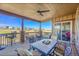 Covered patio with stone columns, a ceiling fan and comfortable outdoor seating at 27655 E Moraine Dr, Aurora, CO 80016