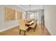 Formal dining room with elegant decor, hardwood floors, a large chandelier, and ample seating at 27655 E Moraine Dr, Aurora, CO 80016