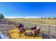 Backyard area featuring a fire pit and seating with a view of a golf course at 27655 E Moraine Dr, Aurora, CO 80016