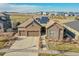 Beautiful stone home with solar panels and a three-car garage in a well-kept neighborhood at 27655 E Moraine Dr, Aurora, CO 80016