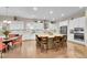 Spacious gourmet kitchen with a large center island, stainless steel appliances, and eat in dining area at 27655 E Moraine Dr, Aurora, CO 80016