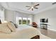 Main bedroom featuring hardwood floors, and an abundance of natural light and ceiling fan at 27655 E Moraine Dr, Aurora, CO 80016