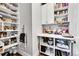 Spacious pantry with ample shelving and cabinet storage at 27655 E Moraine Dr, Aurora, CO 80016