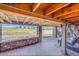 Relaxing stone patio overlooking the golf course, with a comfortable swing and ample space at 27655 E Moraine Dr, Aurora, CO 80016