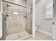 Modern bathroom featuring a frameless glass shower with tile surround at 27655 E Moraine Dr, Aurora, CO 80016