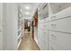 A well-organized walk-in closet featuring custom shelving and ample storage space at 27655 E Moraine Dr, Aurora, CO 80016