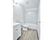 Clean bathroom featuring a tub and shower combination and wood-look flooring at 7185 S Gaylord St # A, Littleton, CO 80122