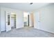 Spacious bedroom with walk-in closet, en-suite bathroom, and comfortable carpet flooring at 7185 S Gaylord St # A, Littleton, CO 80122