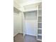 Walk-in closet with carpet and storage shelving at 7185 S Gaylord St # A, Littleton, CO 80122
