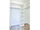 Bright walk-in closet with carpet and white storage shelving at 7185 S Gaylord St # A, Littleton, CO 80122