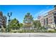 Beautiful South Glenn community with lush landscaping, attractive fountain, and attractive brick apartment buildings at 7185 S Gaylord St # A, Littleton, CO 80122